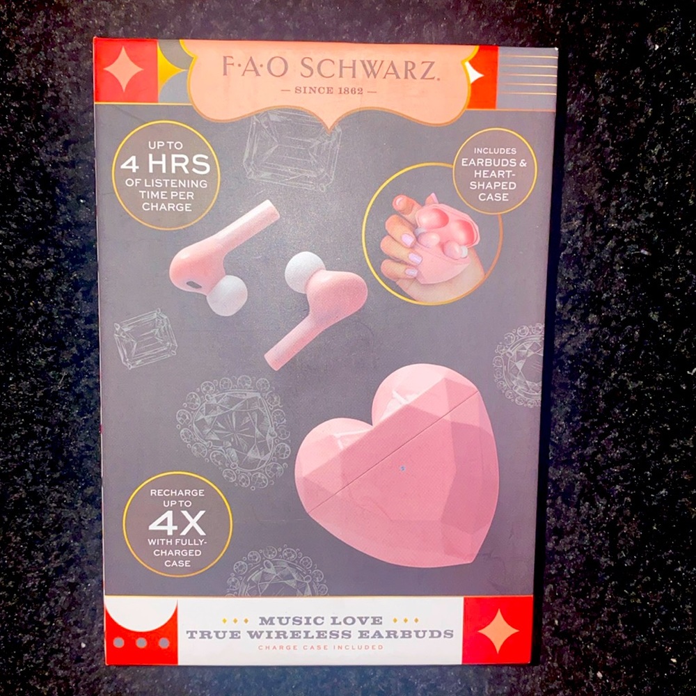 FAO SCHWARZ true wireless earbuds. Heart shaped case. New in box. Never opened
